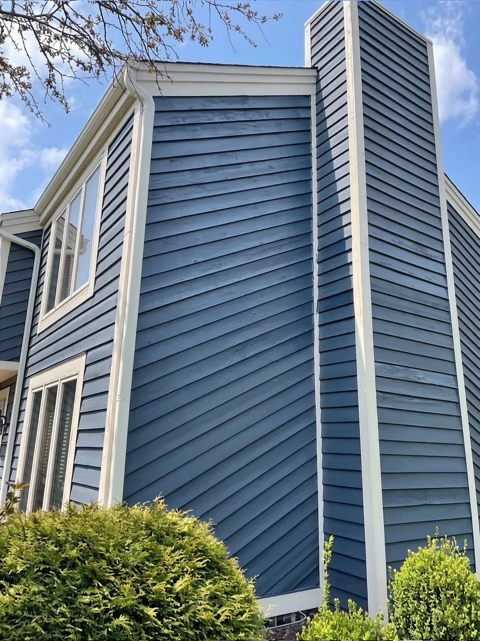 Freshly painted blue cedar siding after exterior painting, Milwaukee area